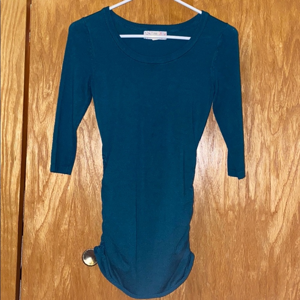 green, long sleeve sweater with gathered sides